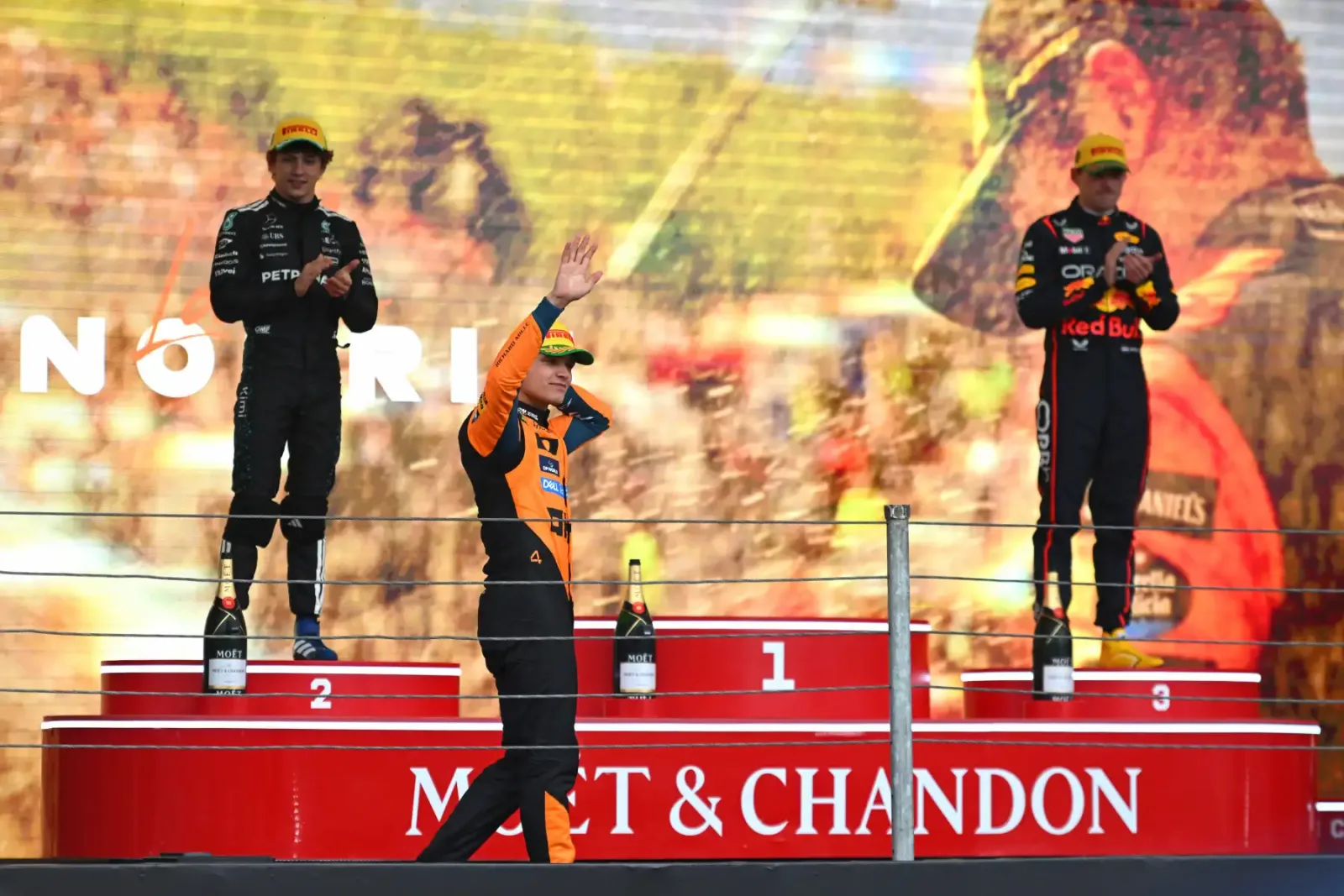 Lando Norris 2025 season victory celebration at the São Paulo Grand Prix podium with Kimi Antonelli and Max Verstappen. © Pirelli Motorsport Media