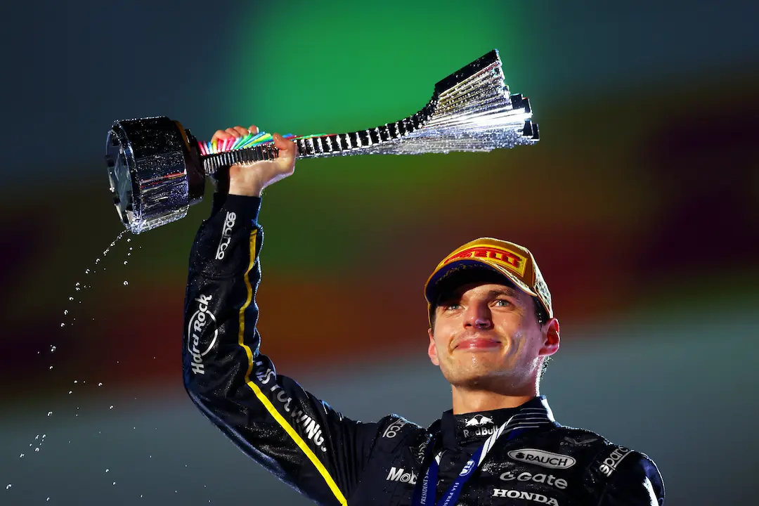 Formula 1 Las Vegas Grand Prix 2025 Race Report: Verstappen Steals the Show in Las Vegas 1 Max Verstappen lifts the Las Vegas Grand Prix trophy during the post-race celebrations, water spraying from the base of the award. © Red Bull Content Pool — F1 Las Vegas Grand Prix 2025 Race Review