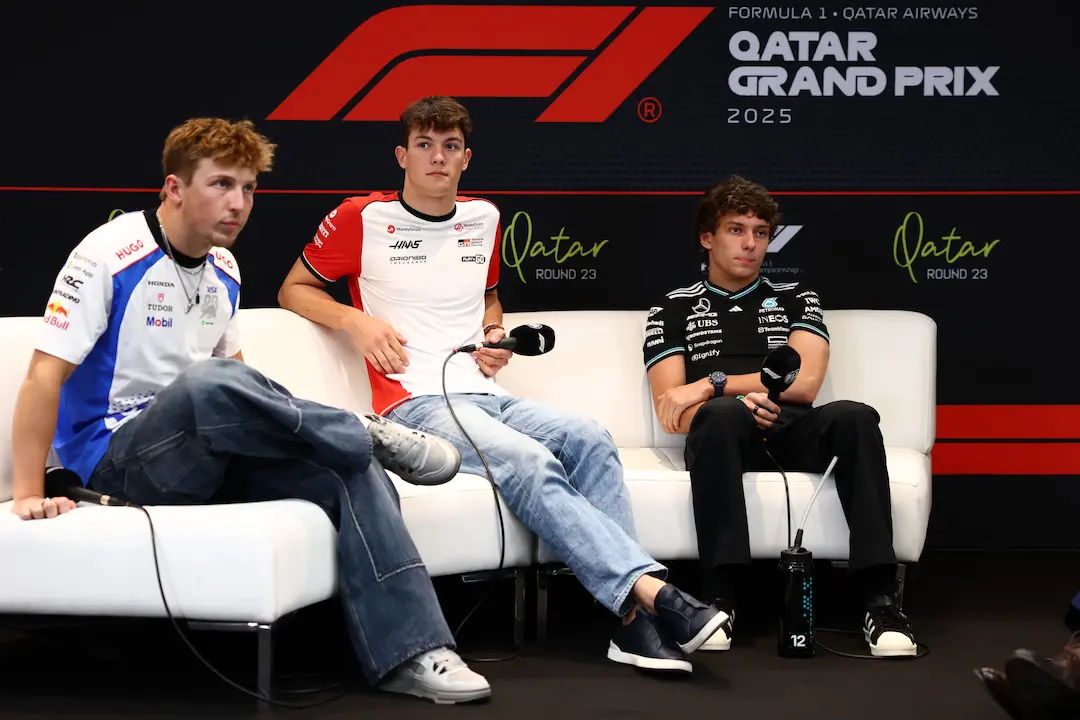 Qatar GP Media Day Round-Up: Key Quotes and Paddock Mood 1 Liam Lawson, Oliver Bearman and Kimi Antonelli during the Qatar GP media day Drivers’ Press Conference at the Qatar Grand Prix 2025 at Lusail International Circuit, sitting on stage with microphones in front of the F1 Qatar GP backdrop. © Red Bull Content Pool / Getty Images