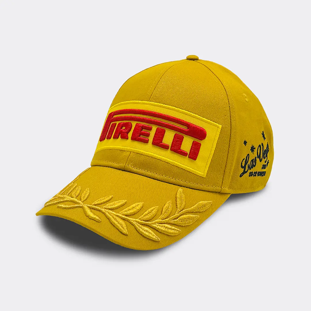 Pirelli’s special gold podium cap for the Las Vegas GP 2025 Tyre Preview featuring embroidered laurels and event branding. © Pirelli Motorsport Media.