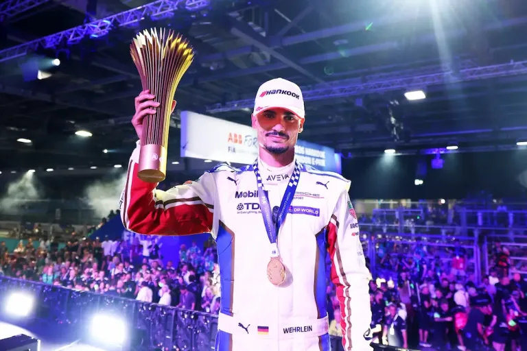 Pascal Wehrlein celebrates victory in the 2026 London E-Prix Round 16 with the winner's trophy © Formula E