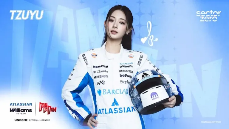 TZUYU Williams F1 collaboration image showing the K-pop star in a white and blue Atlassian Williams F1 Team race suit, holding a Williams helmet against a blue background, with the Williams, DAN DA DAN and Sector Zero logos ©Atlassian Williams F1 Team